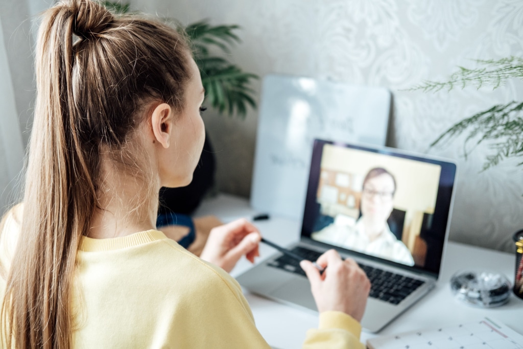 A career nanny interviewing on a computer