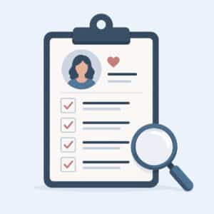 Clipboard with a profile, checklist, heart icon, and magnifying glass, symbolizing a candidate review.